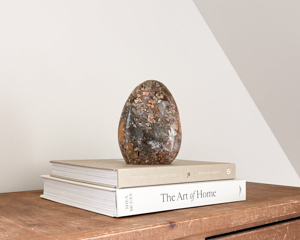 Natural jasper stone sculpture with polished freeform shape