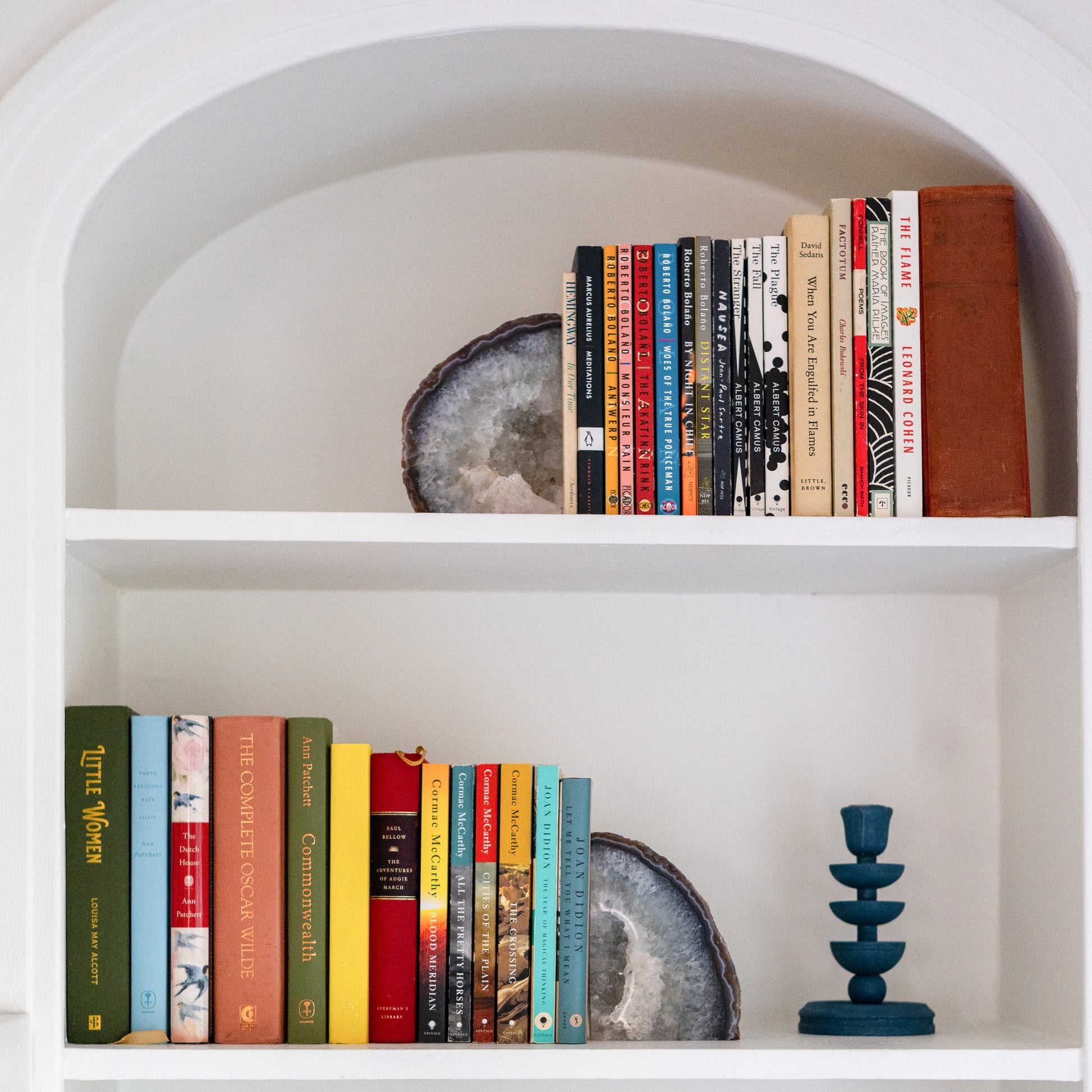 Brazilian blue agate stone bookends featuring natural crystal formations on a built-in bookshelf.