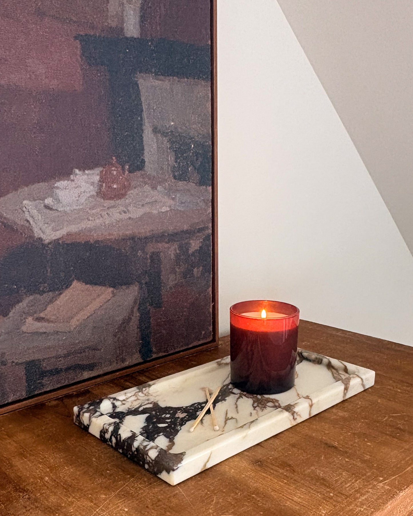 Calacatta Viola marble tray with bold burgundy veining on creamy white stone