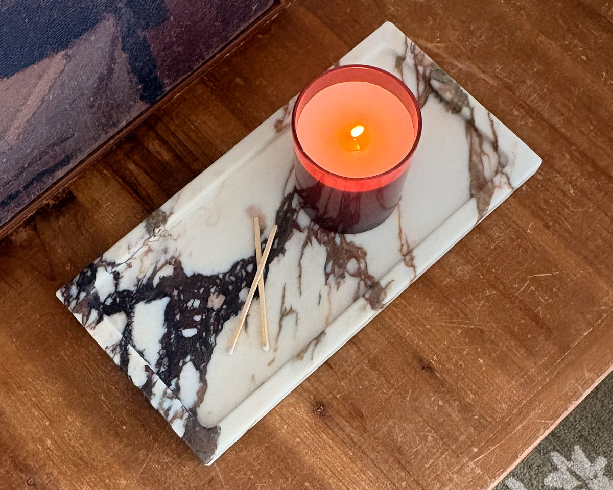 Handcrafted Calacatta Viola marble tray with distinctive natural veining