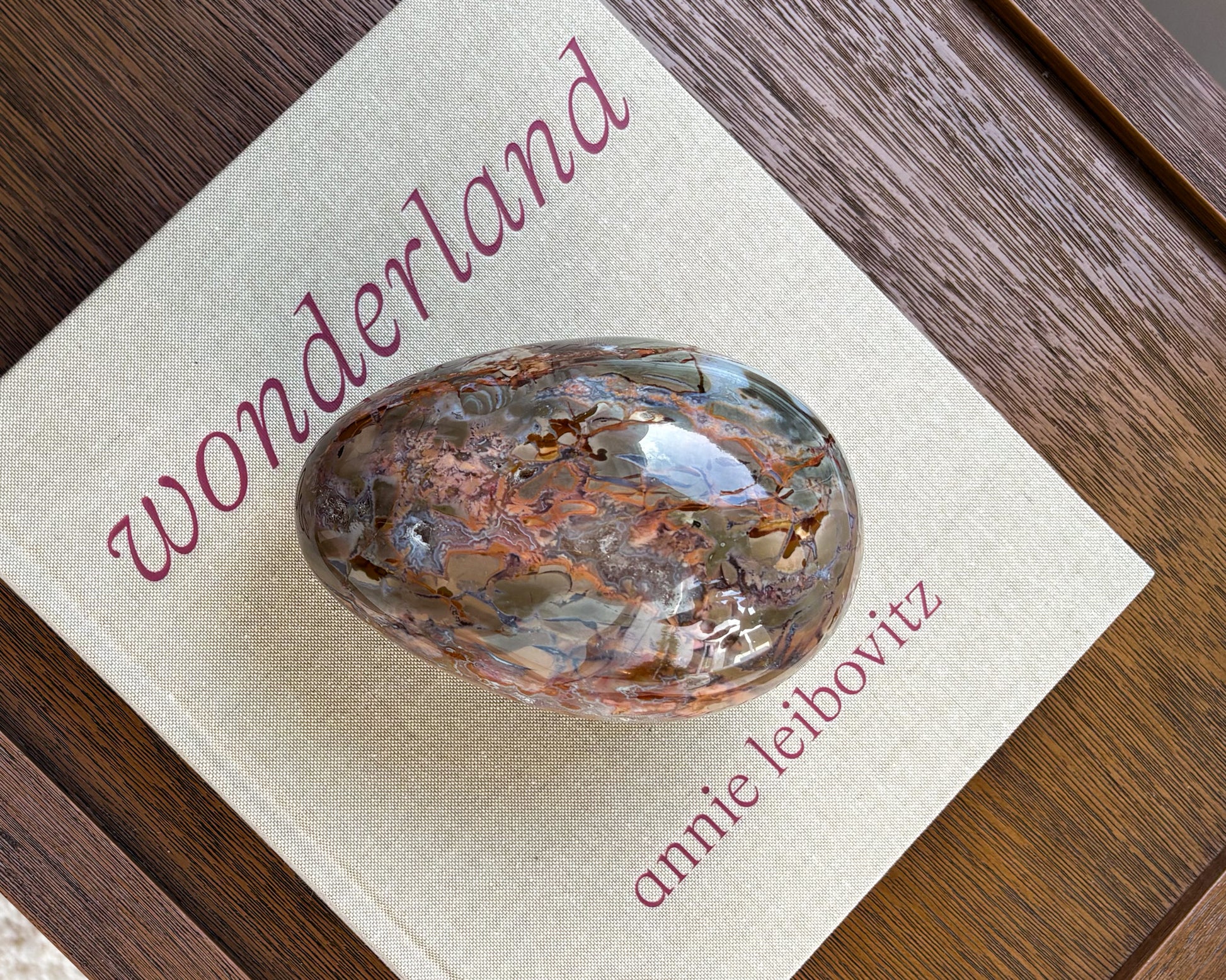 One-of-a-kind polished Ibis Jasper egg with natural earth-tone patterns styled in a modern organic interior
