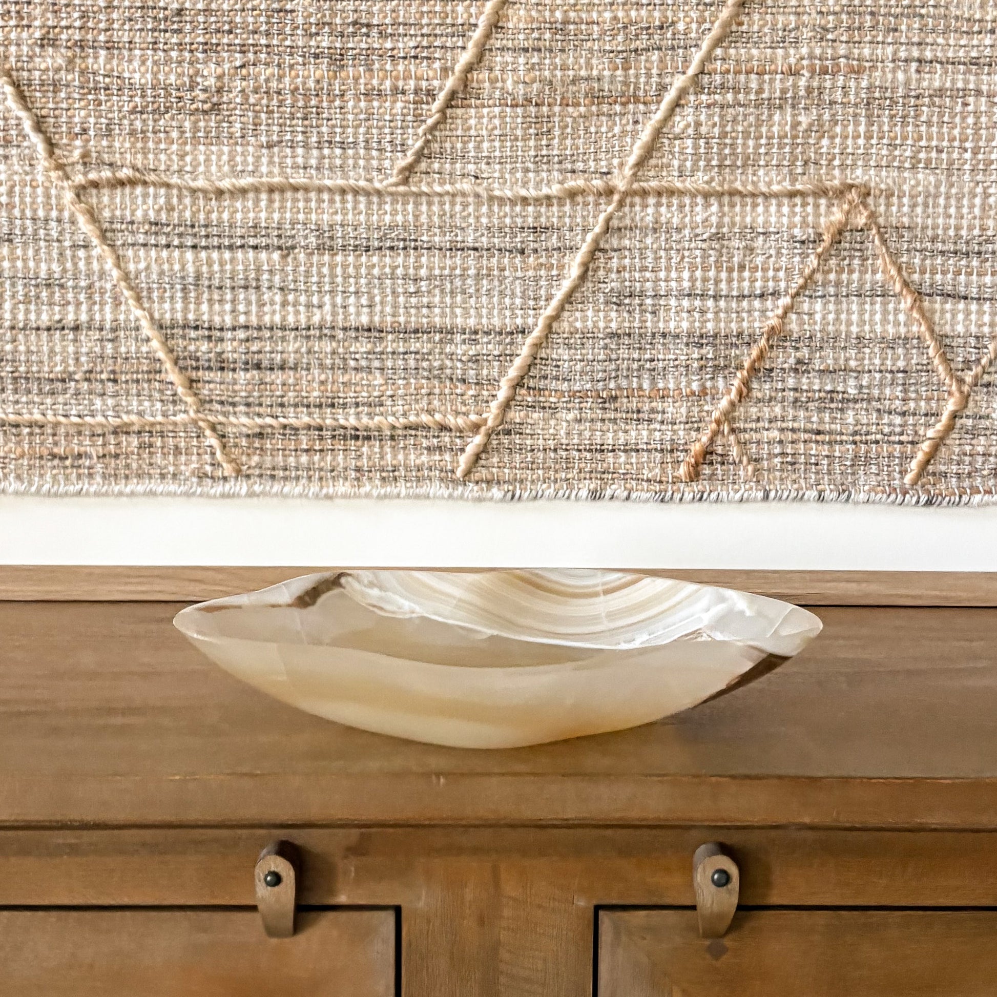 Elegant amber onyx centerpiece bowl with rich veining and translucent stone texture
