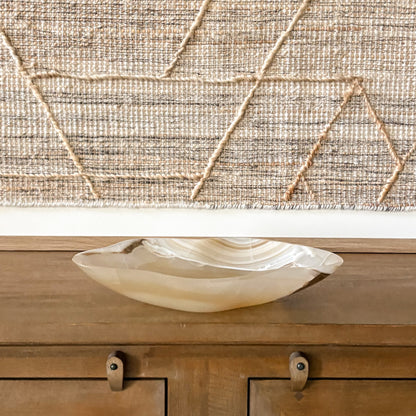 Elegant amber onyx centerpiece bowl with rich veining and translucent stone texture