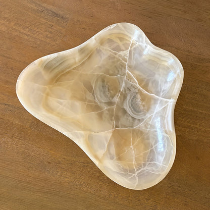 Decorative stone bowl for entryway table styling with natural amber tones