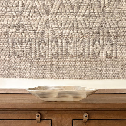 Large hand carved grey onyx bowl displayed as a luxury decorative centerpiece with natural stone veining