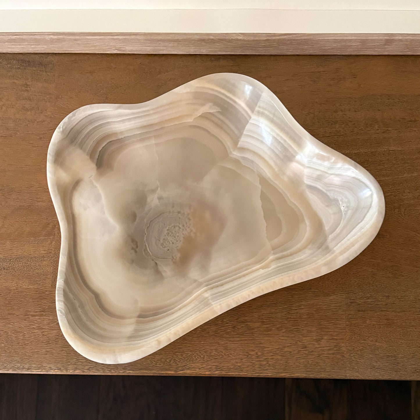 Elegant polished grey onyx bowl featuring natural mineral patterns and artisanal carving