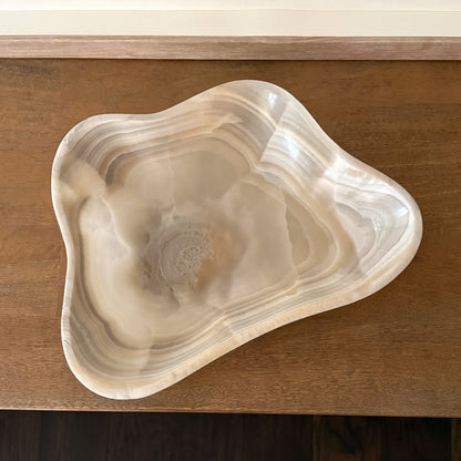 Elegant polished grey onyx bowl featuring natural mineral patterns and artisanal carving