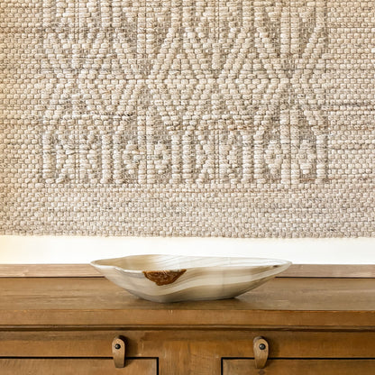 Large carved grey onyx bowl with natural stone patterns and polished finish