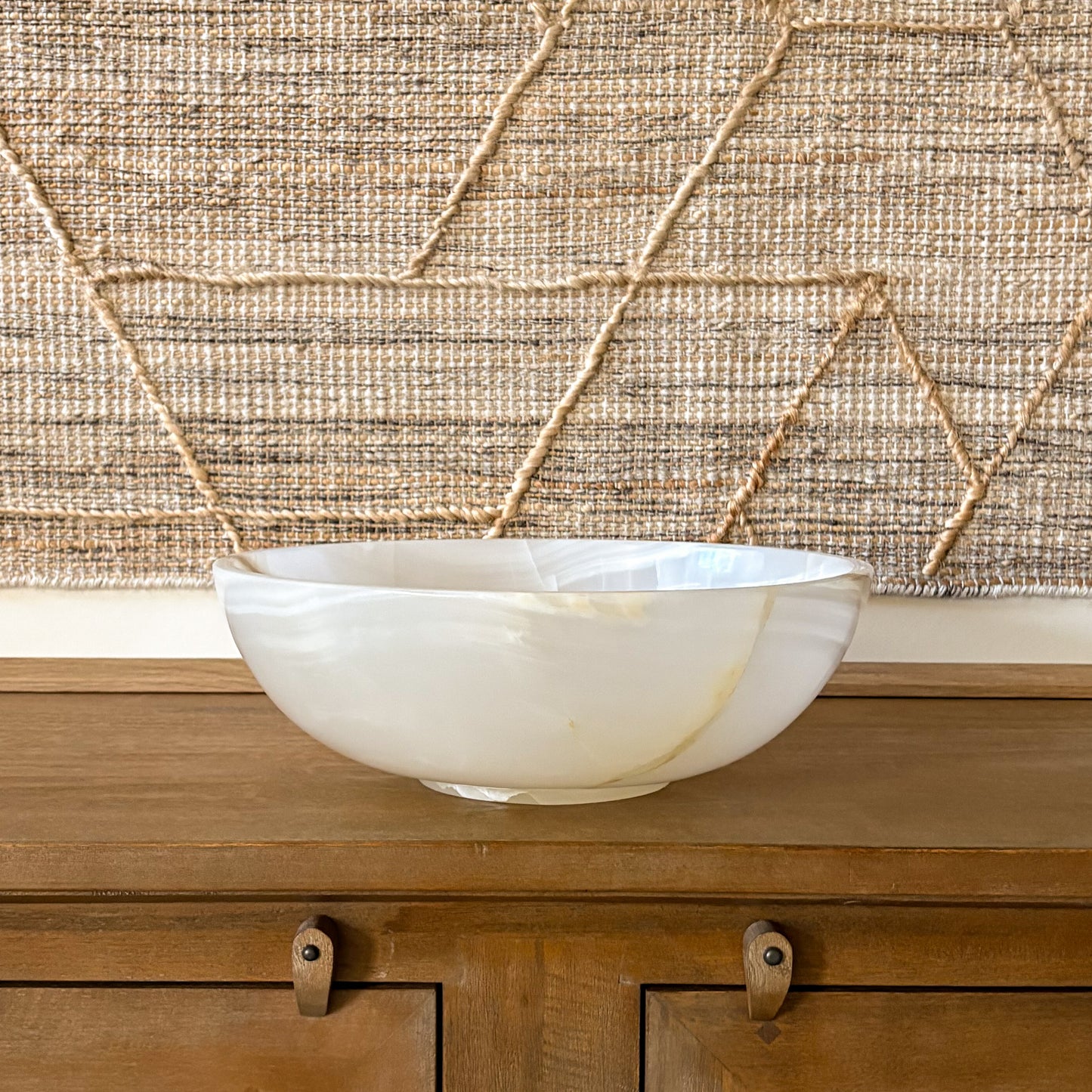 premium onyx bowl texture detail soft white stone with gold veining