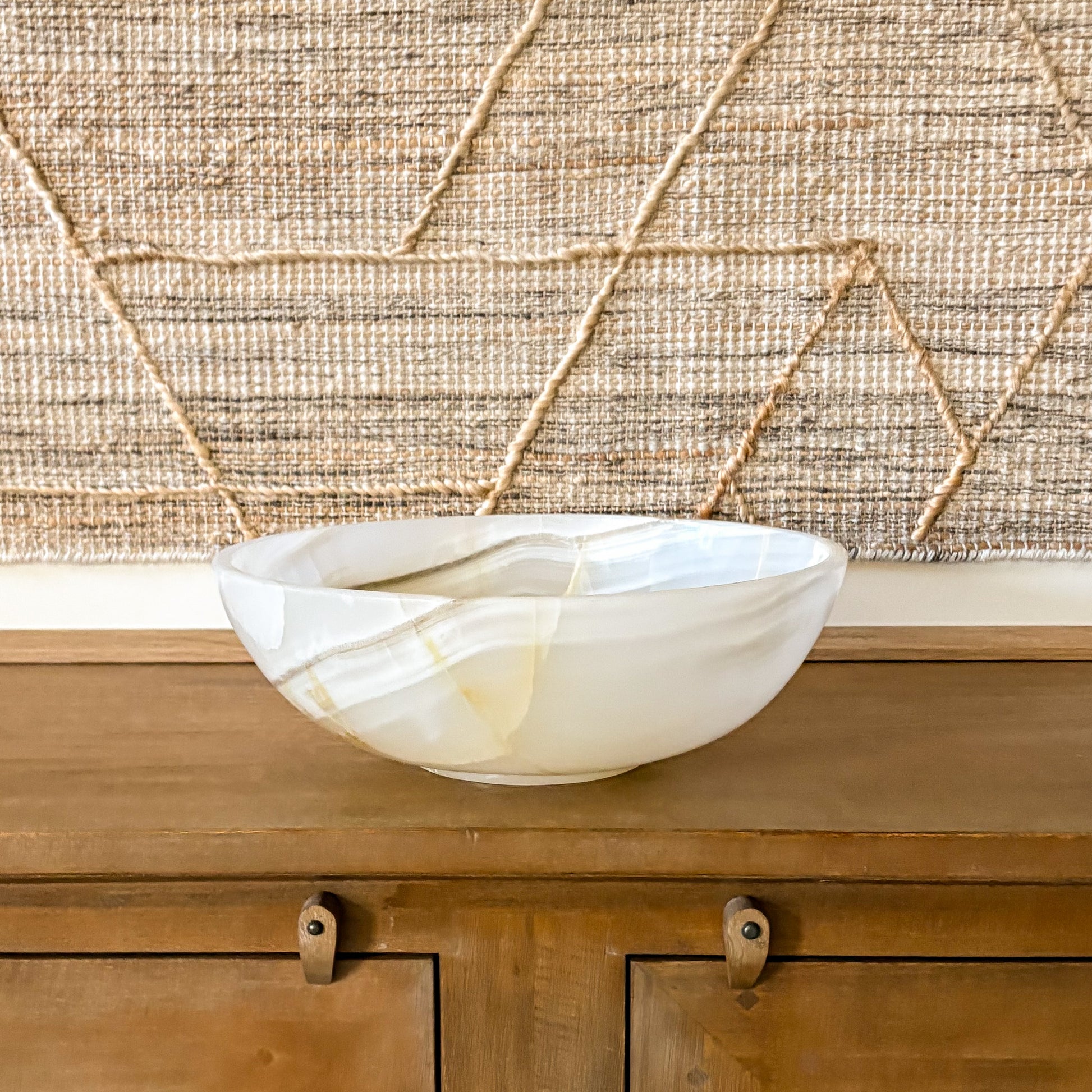 white onyx bowl styled on coffee table luxury modern living room decor