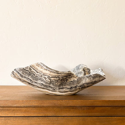Large zebra onyx bowl hand carved from natural stone with striking black and ivory stripes, luxury decorative bowl.