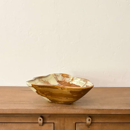 Genuine polished onyx decorative bowl with unique marbled green, brown, and ivory stone veining.