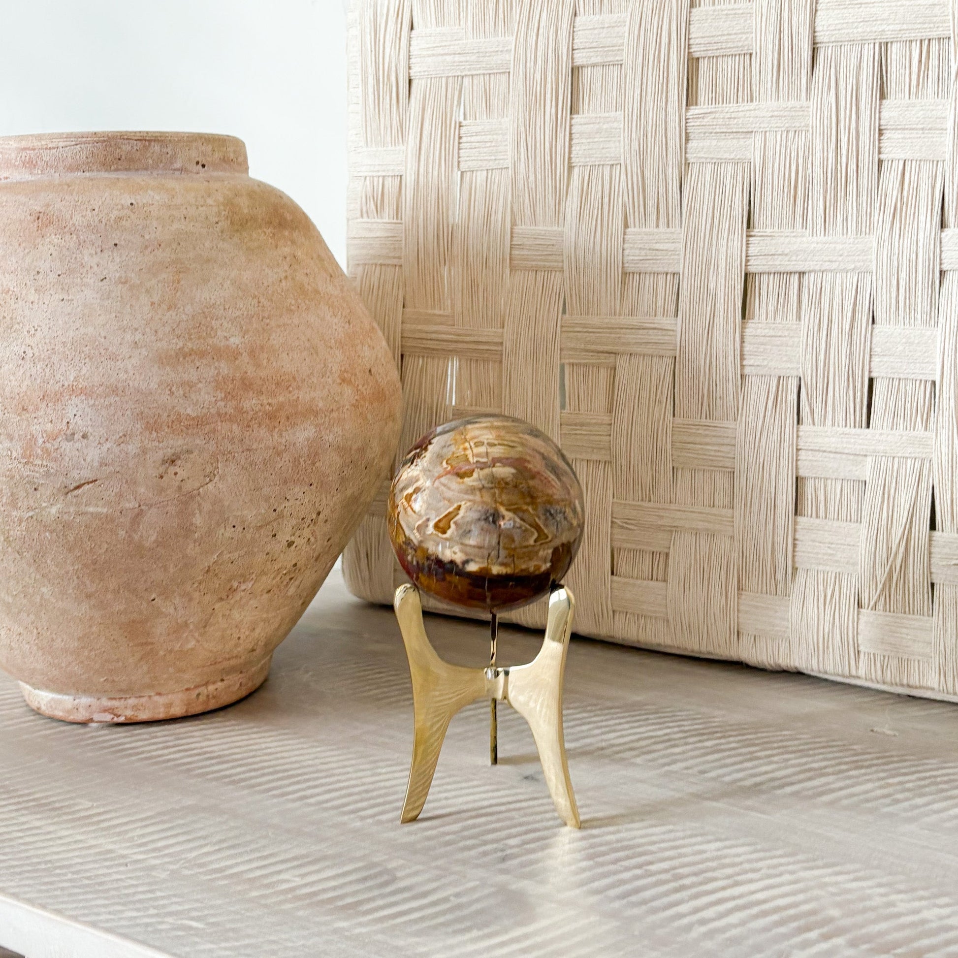 petrified wood orb on brass tripod stand