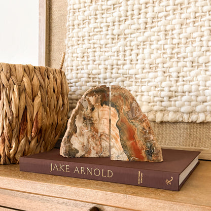Madagascar petrified wood bookend pair with polished fossil wood grain in cream, rust, amber and charcoal tones