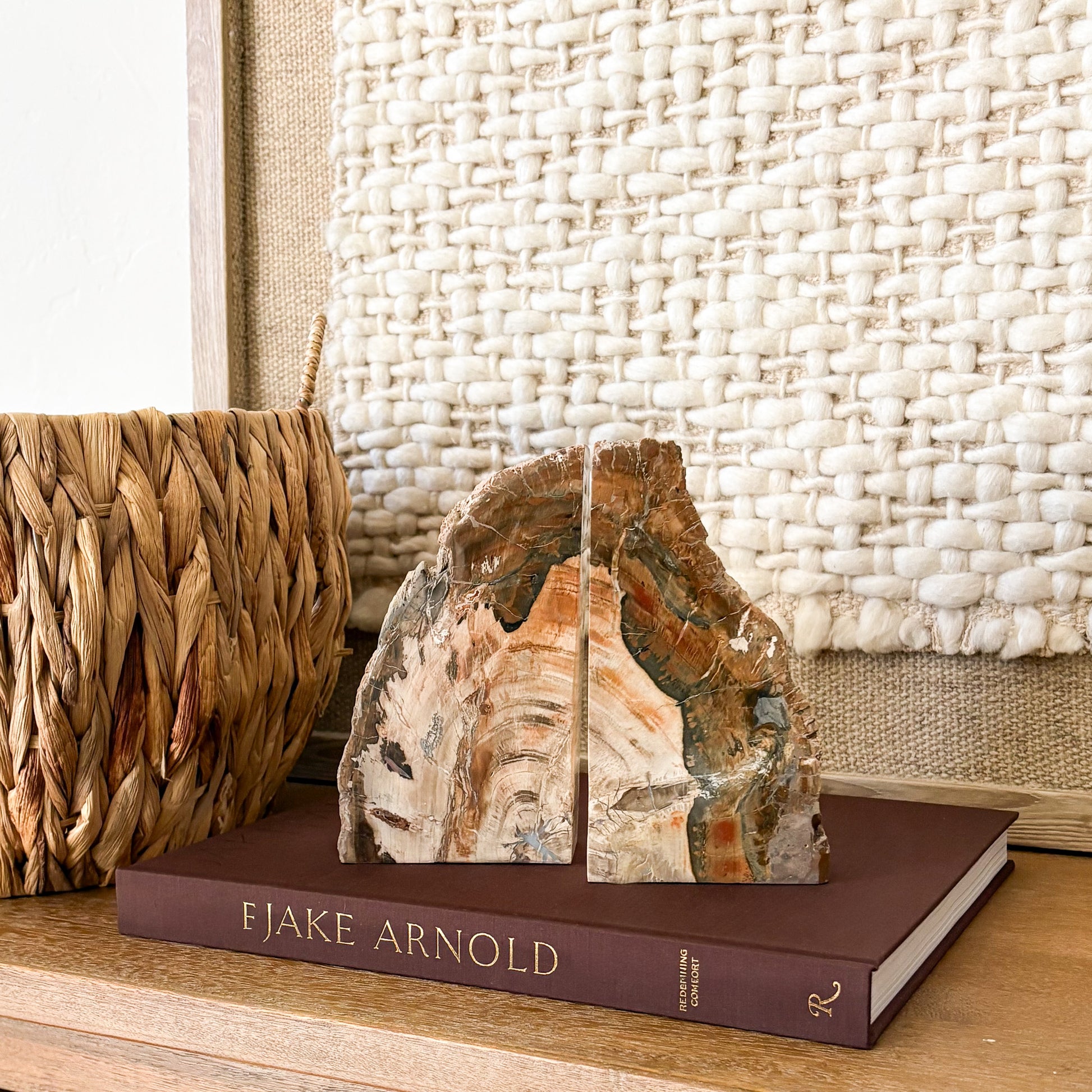Natural Madagascar petrified wood bookend pair with polished stone face and earth tone mineral patterns