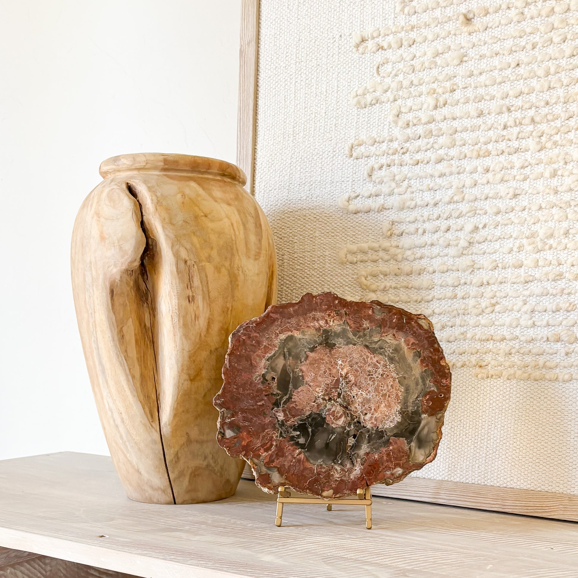 Natural fossil wood slab from Madagascar displayed on modern console