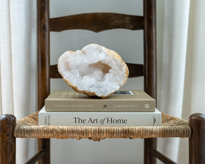 Natural quartz geode half from Morocco displayed as sculptural mineral decor