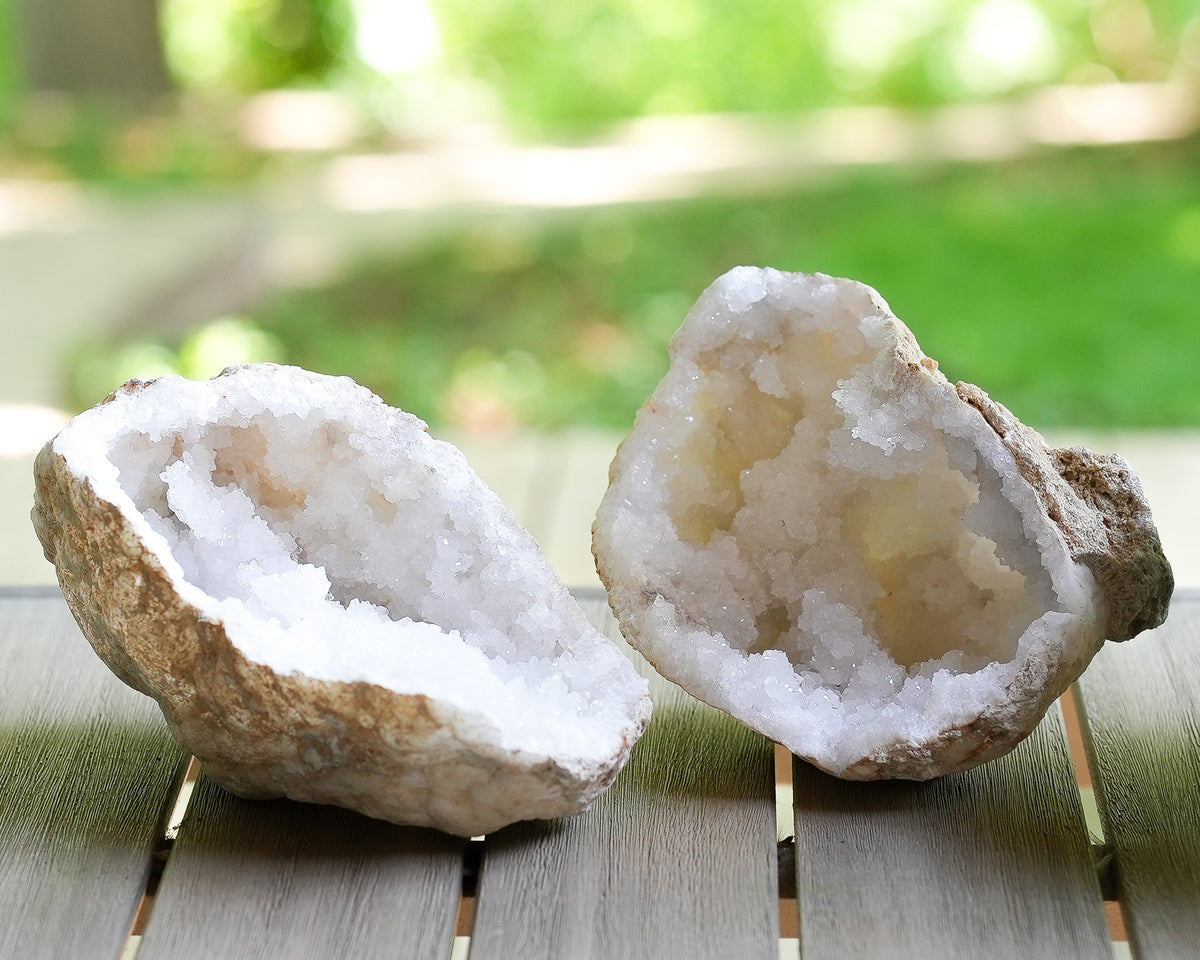 Moroccan quartz geode halves with natural white crystal interiors and rough stone exteriors