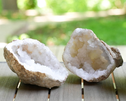 Moroccan quartz geode halves with natural white crystal interiors and rough stone exteriors