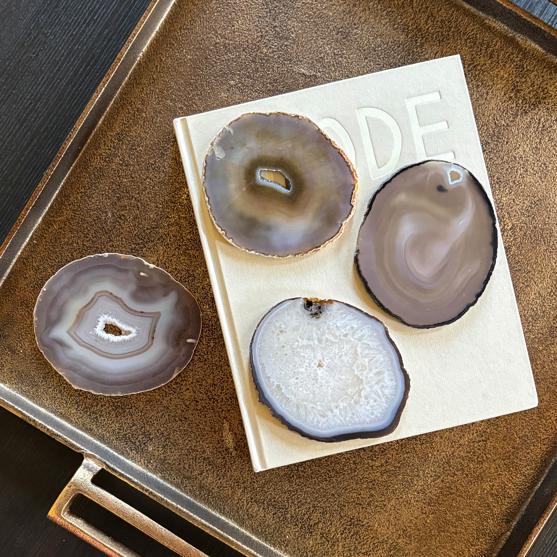 Agate coasters on coffee table with drinks in modern living room