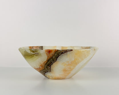 Natural olive onyx stone bowl with unique mineral patterns