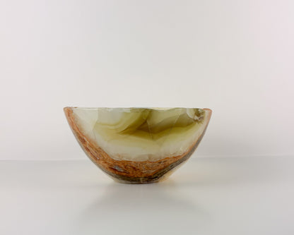 Olive onyx bowl showing natural green, honey, and cream veining