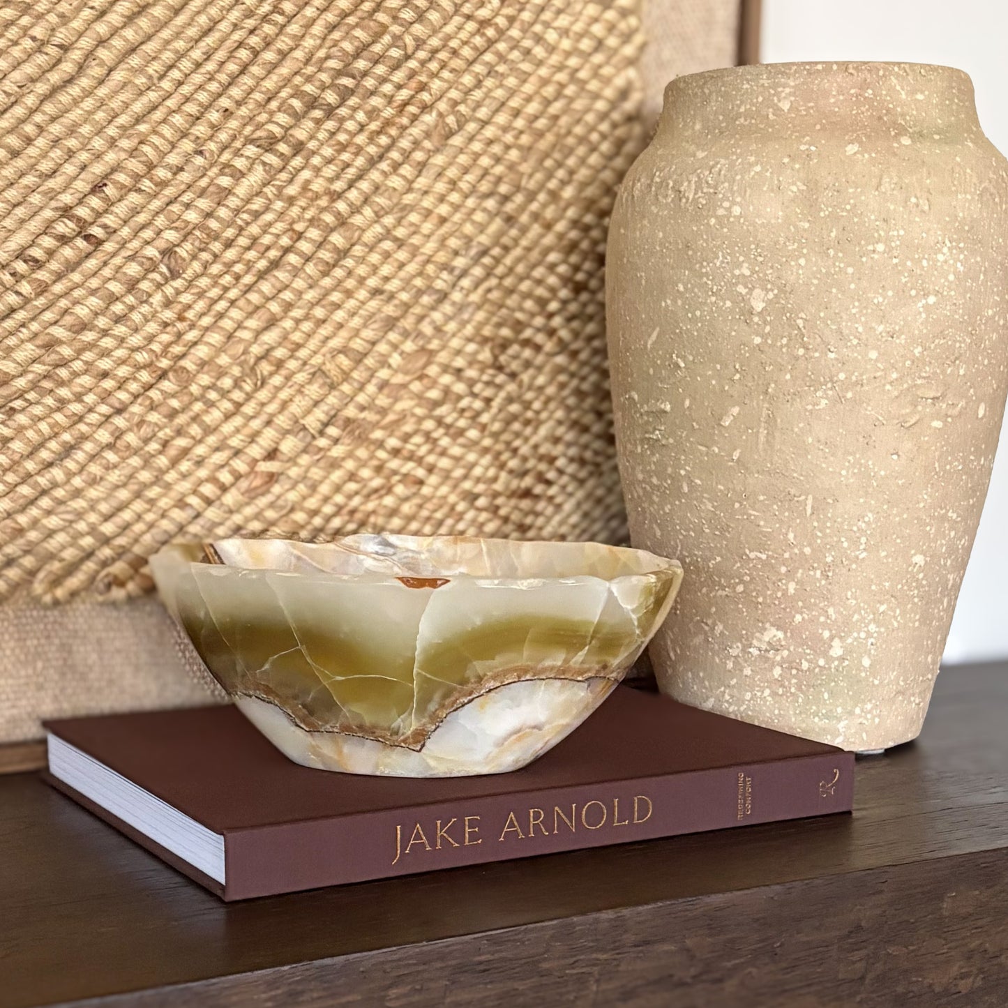 Natural olive onyx decorative bowl on table as home decor accent