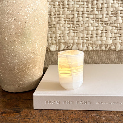 Hand-carved onyx cylinder candle holder