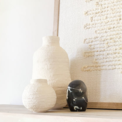 Polished orca agate stone sculpture featuring natural blue and white patterns inspired by killer whales