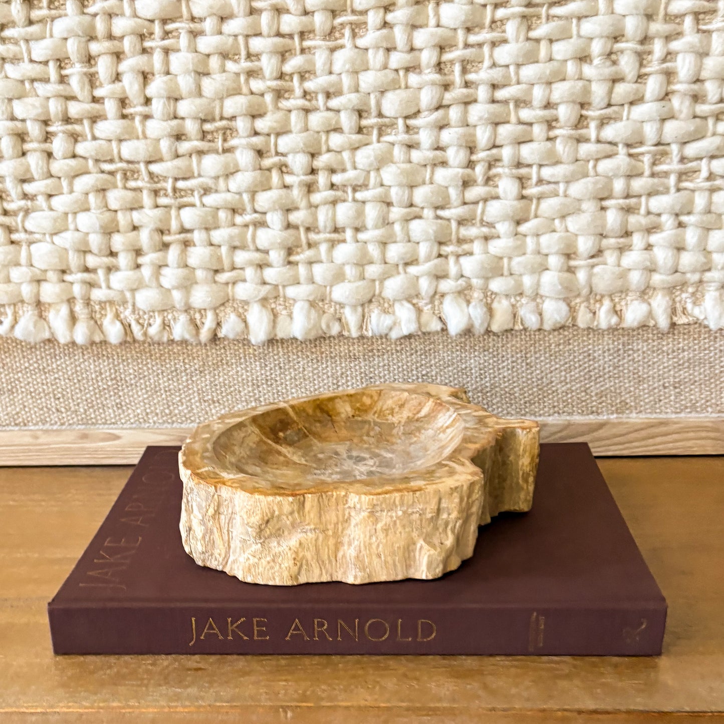 Small natural edge petrified wood bowl from Indonesia with polished fossil wood interior