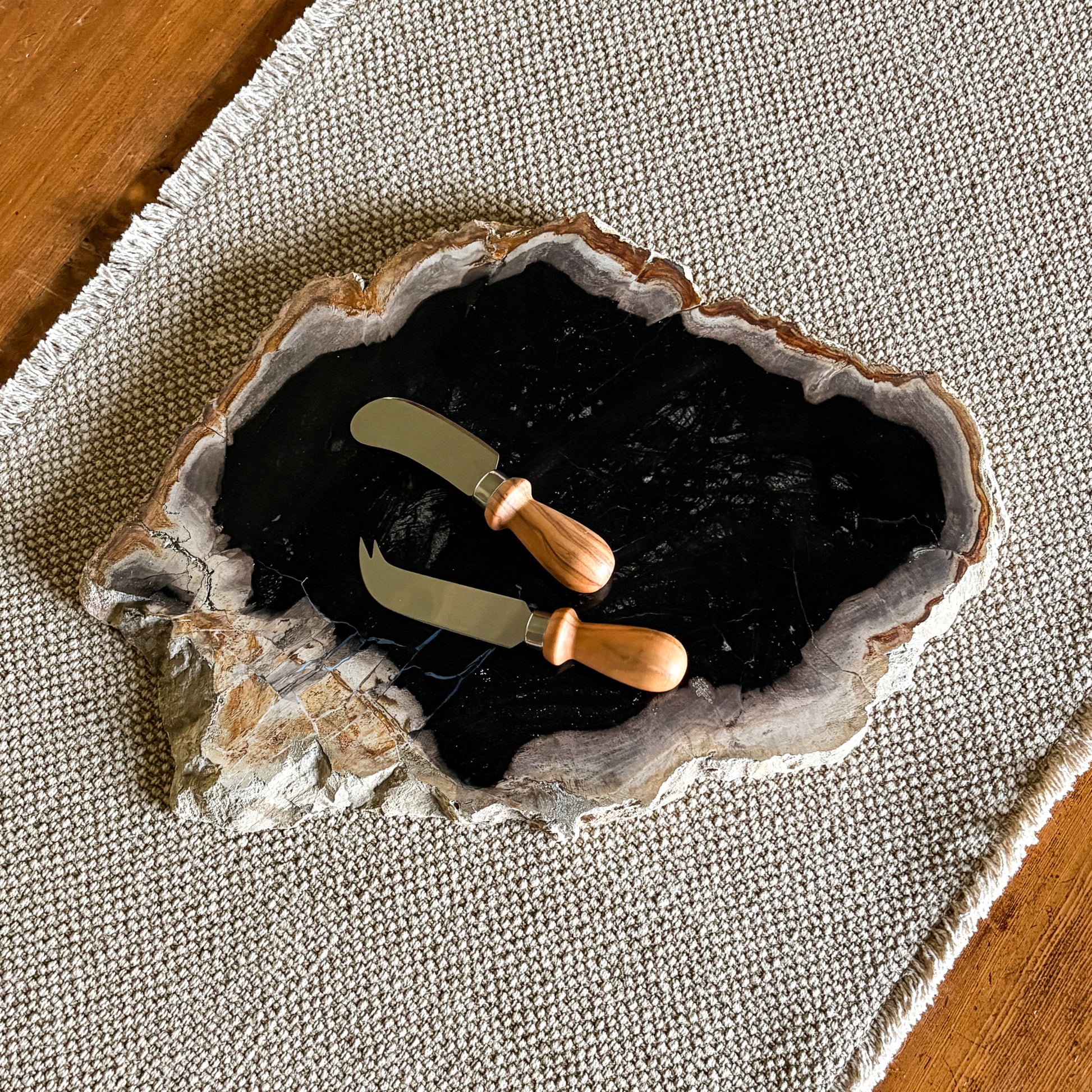 One-of-a-kind petrified wood serving board showcasing natural earth tones and textures