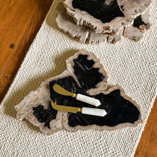 Indonesian petrified wood serving board with natural stone grain and polished finish