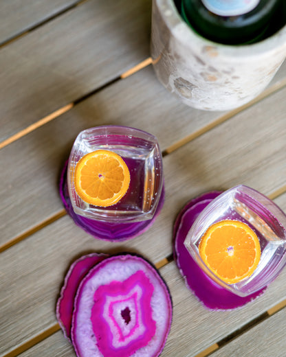 Bright pink fuchsia agate coasters with organic stone patterns