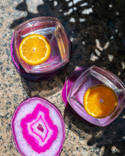 Vibrant fuchsia agate slice coasters with natural variations