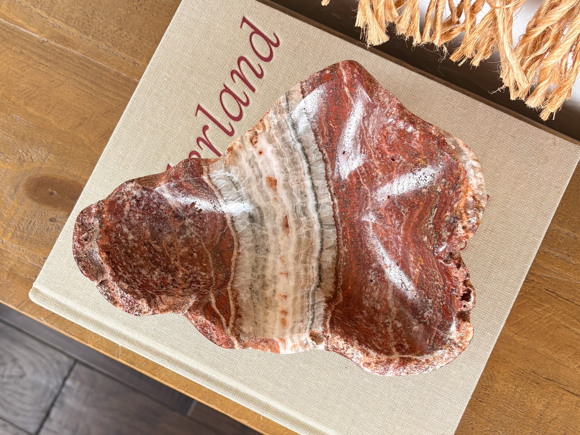 Deep pink serpentine stone bowl with distinctive cream and crimson veining