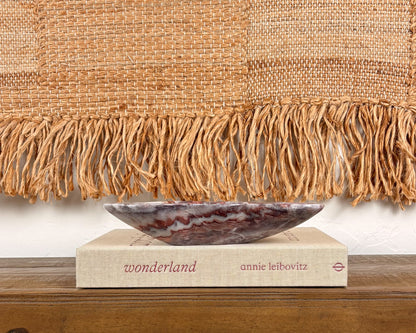 Pink serpentine decorative bowl with dramatic natural mineral veining