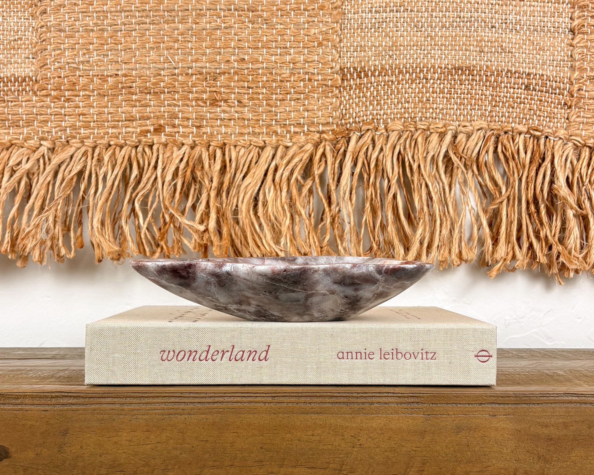 Hand-carved natural stone bowl in deep pink, burgundy and cream tones