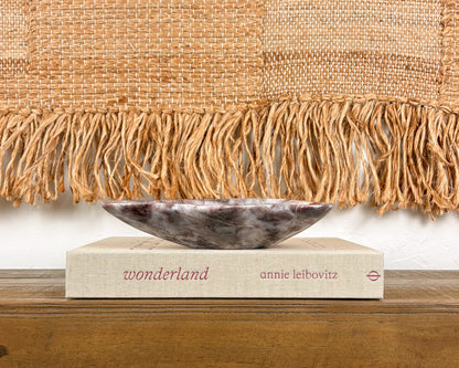 Hand-carved natural stone bowl in deep pink, burgundy and cream tones