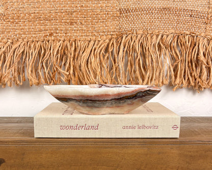 Pink serpentine decorative bowl with organic irregular form and natural veining