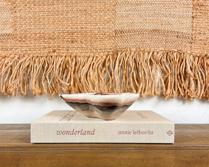 Natural pink serpentine bowl with organic burgundy and cream patterning