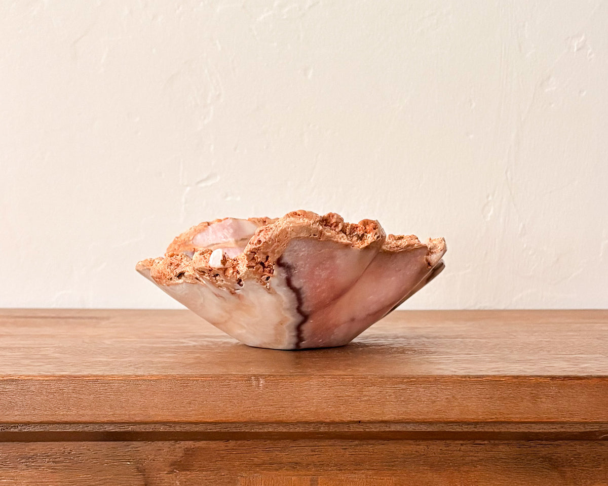 Natural pink serpentine bowl with organic veining