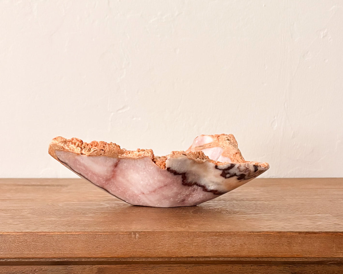 Hand-carved pink serpentine bowl with natural stone variation