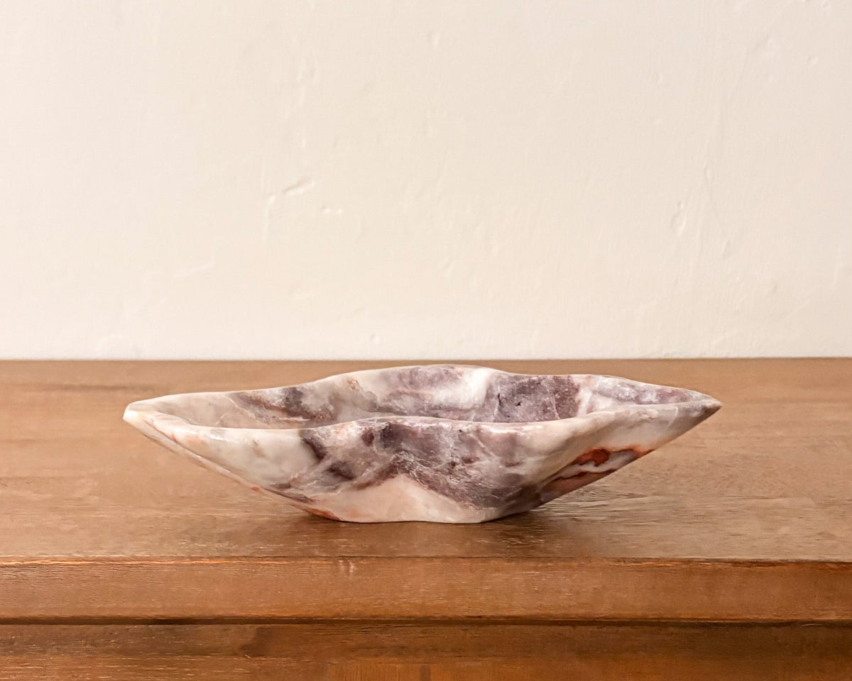 Pink serpentine stone bowl with natural veining