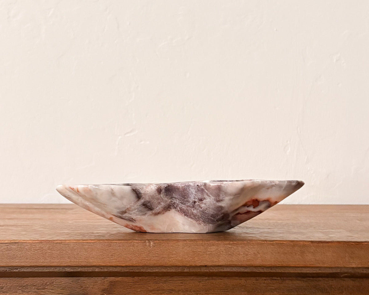 Hand-carved pink serpentine bowl with natural stone variation