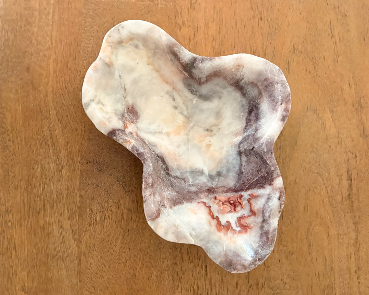 Natural pink serpentine bowl with organic veining