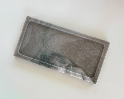 Top view of handcrafted gray Pocahontas marble tray with natural charcoal veining, candle, and matches