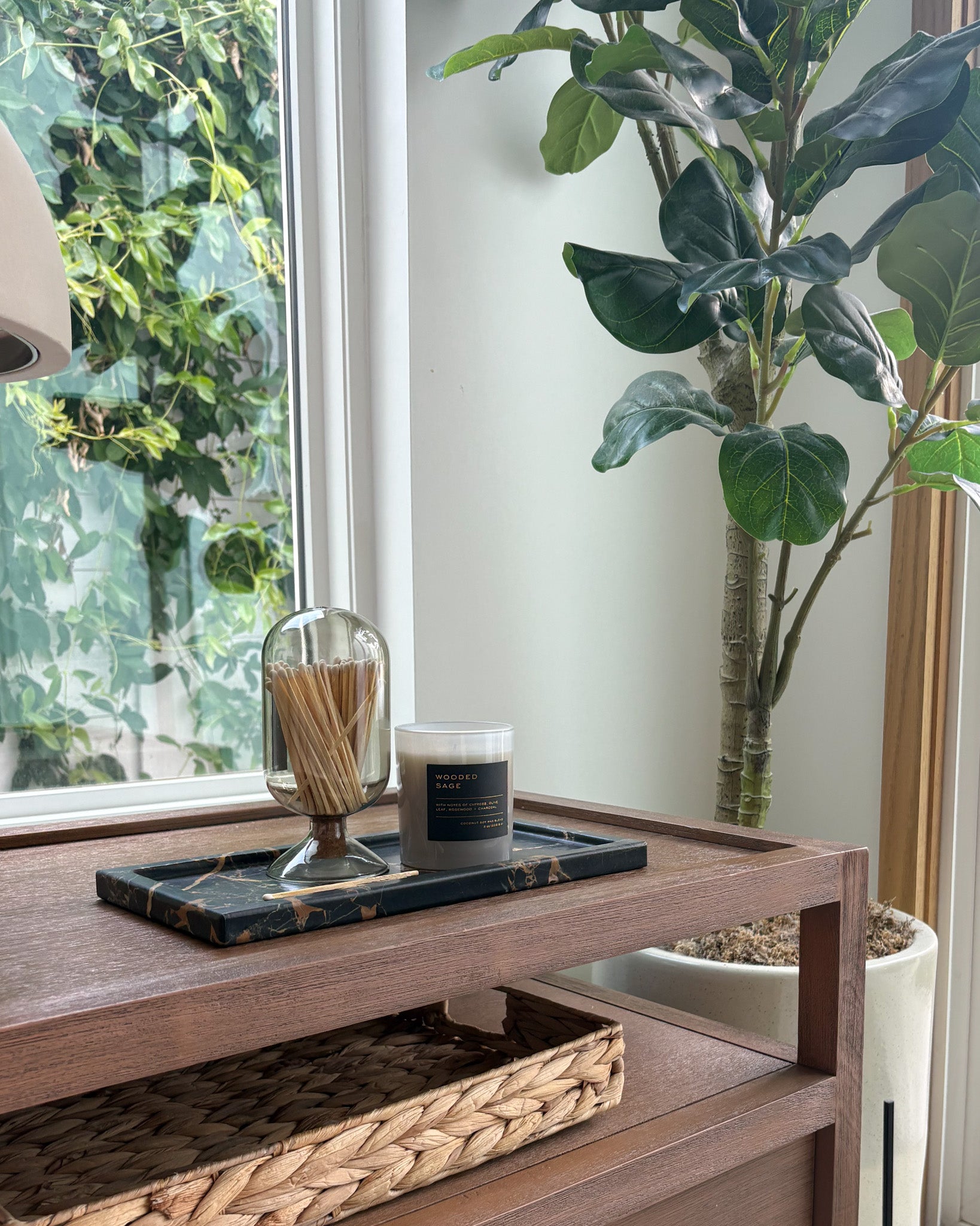 Black Portoro Gold marble tray styled on a nightstand