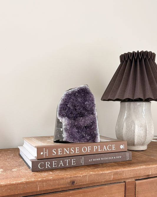 Rainbow amethyst geode with deep purple crystal formation