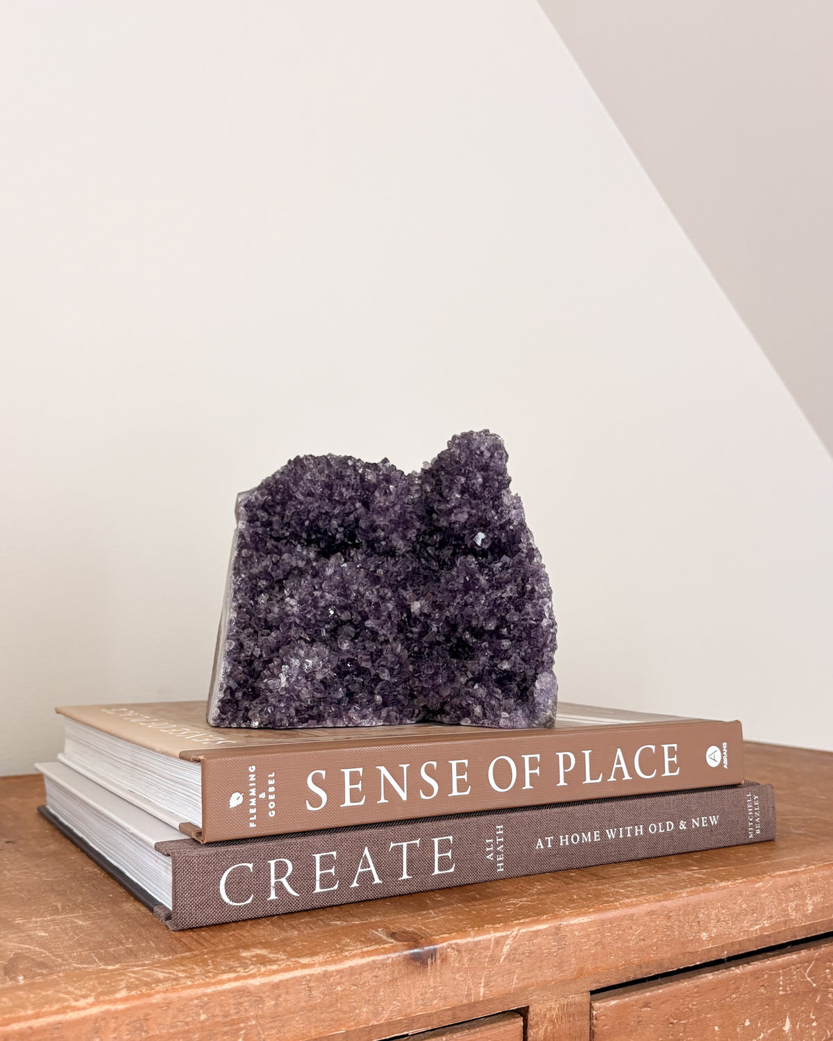 Natural rainbow amethyst geode with violet and lavender crystals