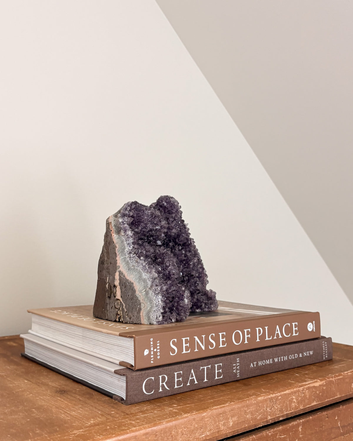 Rainbow amethyst geode with natural stone matrix and crystal face